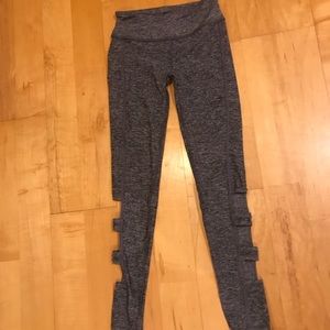 Stretchy grey leggings with cut outs on bottom